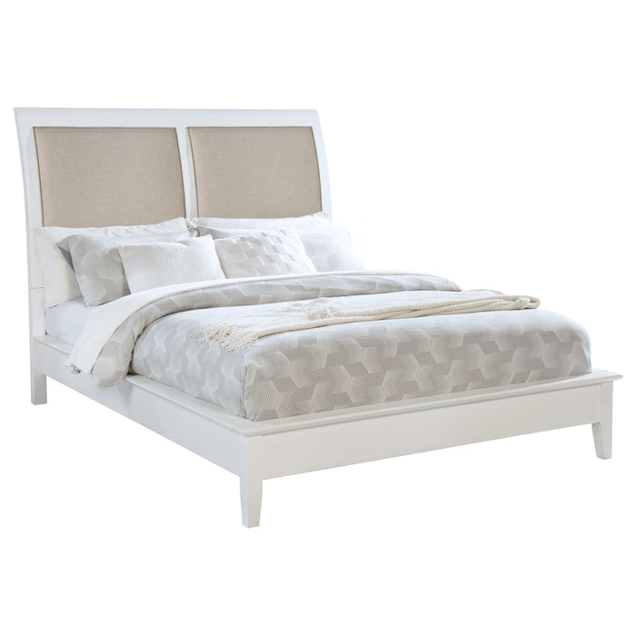 White upholstered Bexhill 56-inch queen panel bed with a modern furniture design, featuring a padded headboard and clean lines.