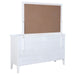 White Bexhill 10-drawer dresser with matching mirror, showcasing sleek wooden furniture from CoasterEveryday.