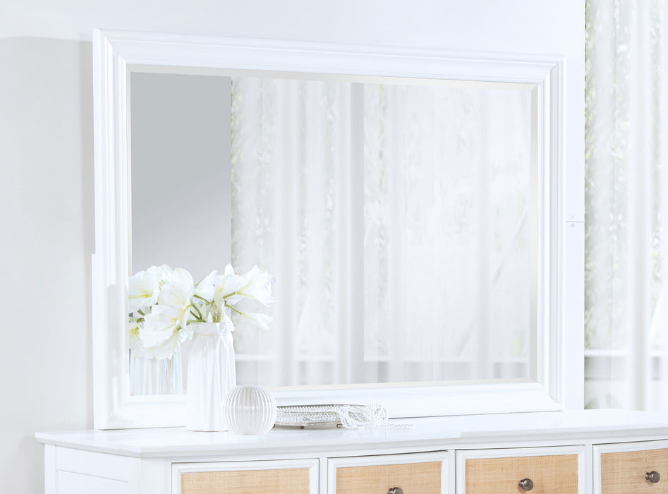 White Bexhill dresser mirror from CoasterEveryday, showing a sleek rectangular frame and clear reflective glass on a furniture piece.