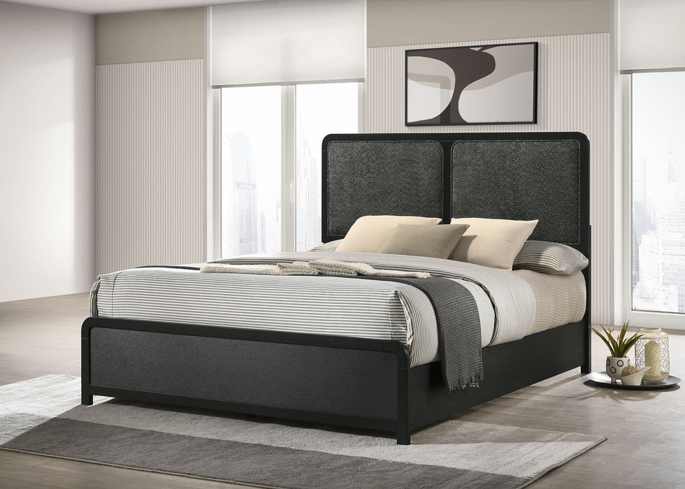 Black upholstered 51-inch queen panel bed by CoasterEveryday, showcasing a stylish and modern furniture design.