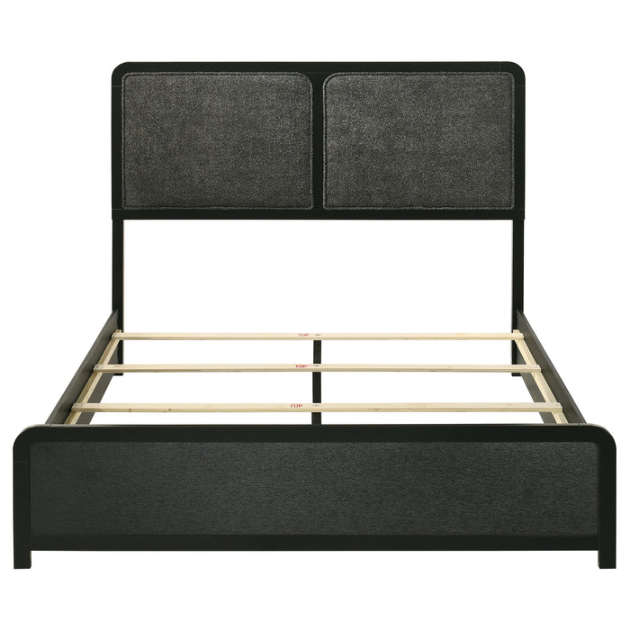 Black upholstered Cavelle 51-inch queen panel bed from CoasterEveryday, showcasing the headboard and side panels in a modern furniture design.