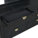 Black Brookmead 4-piece Cal King bedroom furniture set by CoasterEveryday, including upholstered bed and matching pieces.