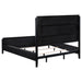 Black upholstered California king bed from Brookmead, featuring a modern furniture design with a tall headboard.