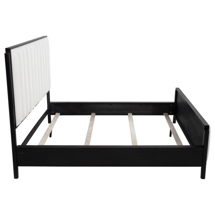 Black upholstered California King bed from Brookmead, featuring a modern furniture design with a sturdy frame and plush headboard.