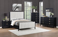 Black upholstered California King bed from Brookmead collection by CoasterEveryday, featuring a modern furniture design and plush headboard.