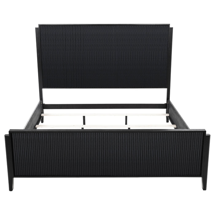 Eastern King Panel Bed in black wood with a sleek, modern design by CoasterEveryday, shown in a contemporary bedroom setting.