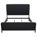 Eastern King Panel Bed in black wood with a sleek, modern design by CoasterEveryday, shown in a contemporary bedroom setting.