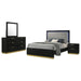 Black Caraway 4-piece California King bedroom furniture set by CoasterEveryday, includes bed frame, nightstands, and dresser.