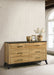 Natural pine Kaywood 6-drawer dresser cabinet with wooden handles, showcasing a sturdy furniture piece in a modern bedroom setting.