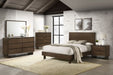 CoasterEveryday Glenwood 6-drawer dresser with matching mirror in warm brown wood finish, showing sleek drawer handles and smooth surface.