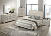 Rustic cream CoasterEveryday Trenton 2-drawer nightstand with wooden finish and metal handles, showcasing its bedside table design.