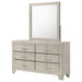 Rustic cream CoasterEveryday Trenton 6-drawer bedroom dresser with attached mirror, showcasing wood grain and elegant hardware.