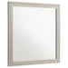 Rustic cream Trenton dresser mirror by CoasterEveryday, featuring a rectangular shape with a wooden frame and decorative accents.