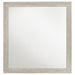 Rustic cream Trenton dresser mirror by CoasterEveryday, wooden frame with oval shape, mounted on a bedroom dresser.