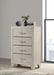 Rustic cream CoasterEveryday Trenton 4-drawer bedroom chest of drawers with wood finish and metal handles.