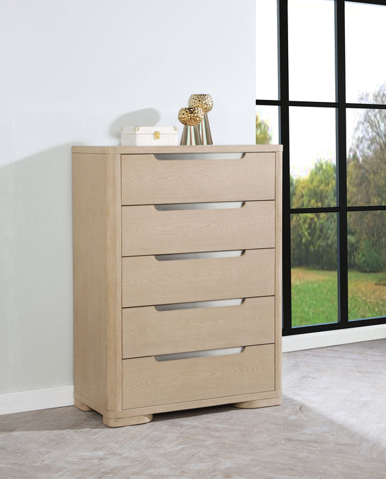 Light elm Ladera 5-drawer bedroom chest of drawers by CoasterEveryday, showcasing sleek wooden furniture with metal handles.