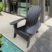 Giga outdoor wood Adirondack armchair with built-in umbrella hole on the arm, ideal for outdoor or indoor relaxing spaces.