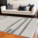 Machine woven 9x13 ivory gray abstract color block indoor area rug by HomeRoots, showcasing a modern geometric design.