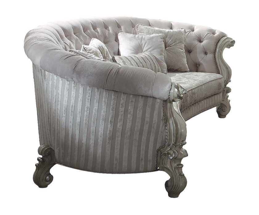 Velvet curved floral sofa with ivory upholstery, gray legs, and matching toss pillows by HomeRoots, stationary living room furniture.