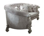 Velvet curved floral sofa with ivory upholstery, gray legs, and matching toss pillows by HomeRoots, stationary living room furniture.