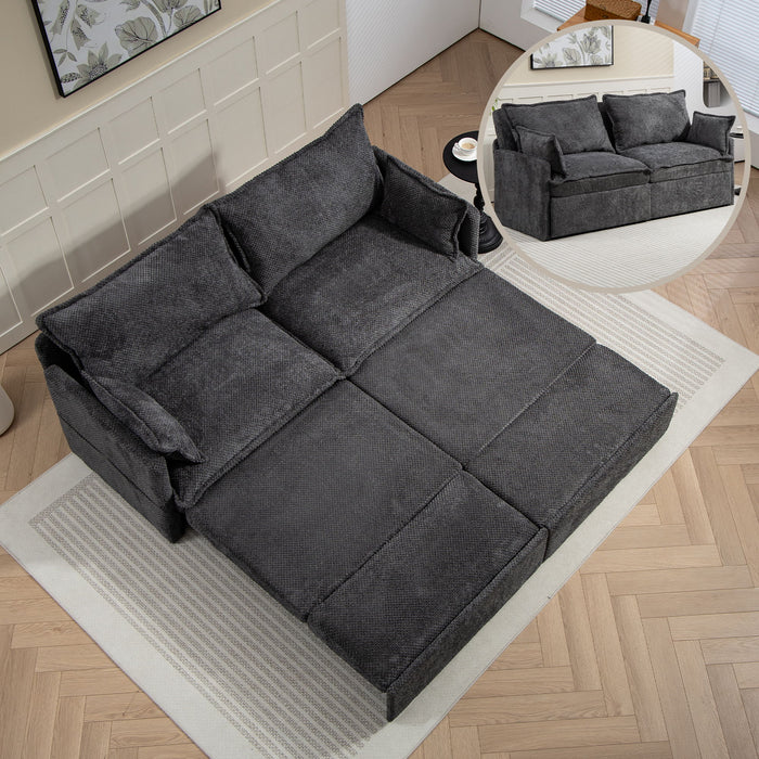 Giga pull-out sofa bed with convertible sleeper function, side storage, and built-in USB-C charging ports in a modern living room setting.