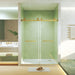 Giga frameless double sliding shower door with tempered glass, brushed gold square tube track, explosion-proof film, modern bathroom style