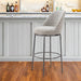 Gray and black fabric and steel bar height swivel chair with a modern design, suitable for kitchen or bar areas.