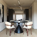 Set of two Giga mid-century modern bentwood swivel dining chairs in white with walnut legs, showcasing sleek, curved design.