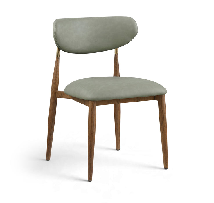 Vegan leather upholstered Meridian Furniture Ronda dining side chair with walnut wood legs and modern design.