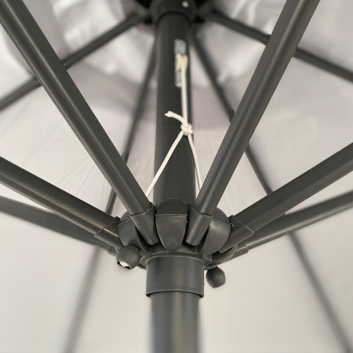 Giga patio market umbrella with 8 steel ribs, UV-resistant and waterproof canopy, providing shade for outdoor seating areas.