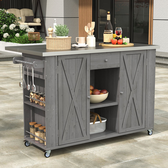 Giga outdoor kitchen island with stainless steel top, ample storage, towel and spice racks, and bottle opener in a backyard setting.