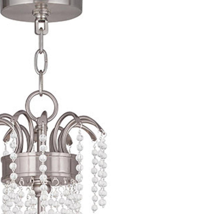 28-inch six-light metal chandelier with shades in nickel finish, dimmable design, by HomeRoots, featuring clear glass shades.