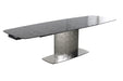 Contemporary extendable dining table by Chintaly with gloss black textured glass top and stainless steel base, ideal for modern dining rooms.