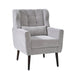 Giga modern accent armchair with soft upholstery, wooden legs, and pillow, ideal for living room or bedroom seating in small spaces.