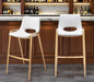 Set of two white faux leather and steel low back bar chairs with gold accents by HomeRoots, perfect for modern bar or kitchen.