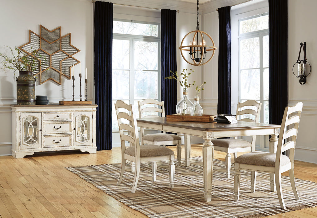 Signature Design by Ashley Realyn rectangular 8-piece dining table set with matching chairs and table in a modern dining room style.