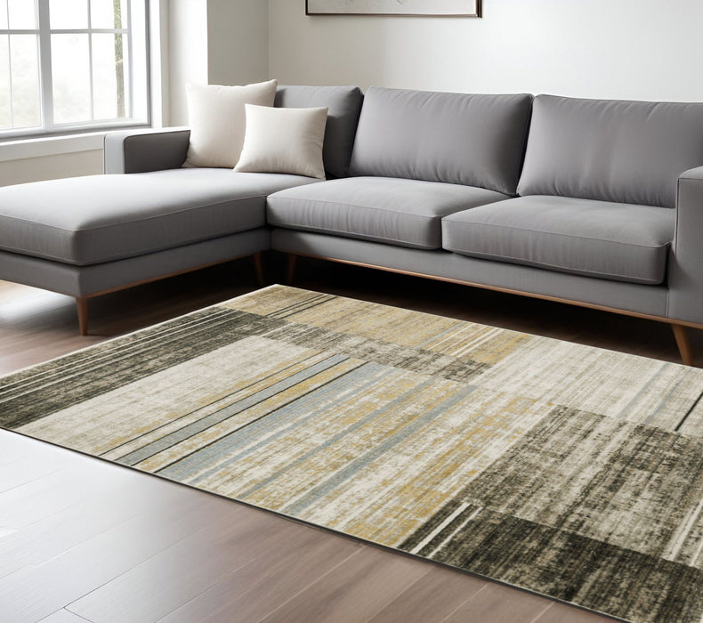 6' x 9' Geometric Power Loom Stain Resistant Area Rug With Fringe - Beige Charcoal Brown Gray Tan Gold And Blue