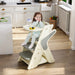 Giga multifunctional highchair for kids with adjustable height and 5-point seat belts, shown in a modern dining setting.