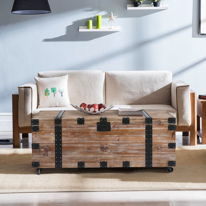 Set of three antique gray Giga trunk and side tables with large storage, ideal for living room organization and style.