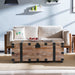 Set of three antique gray Giga trunk and side tables with large storage, ideal for living room organization and style.