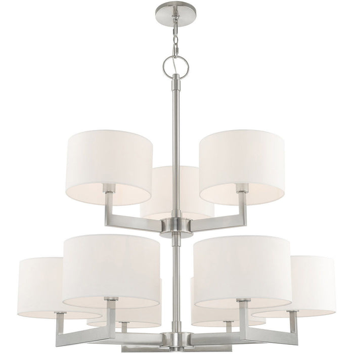 HomeRoots 43-inch nine-light metal chandelier with shades, dimmable, featuring nickel finish and off-white shades for elegant lighting.