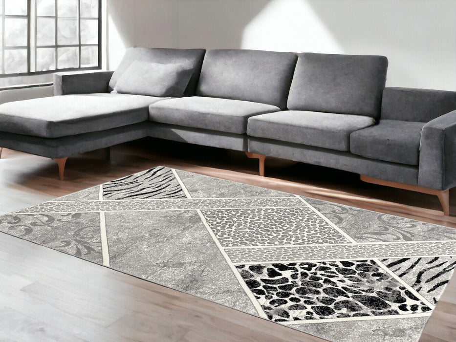 8' x 11' Geometric Power Loom Stain Resistant Area Rug - Gray