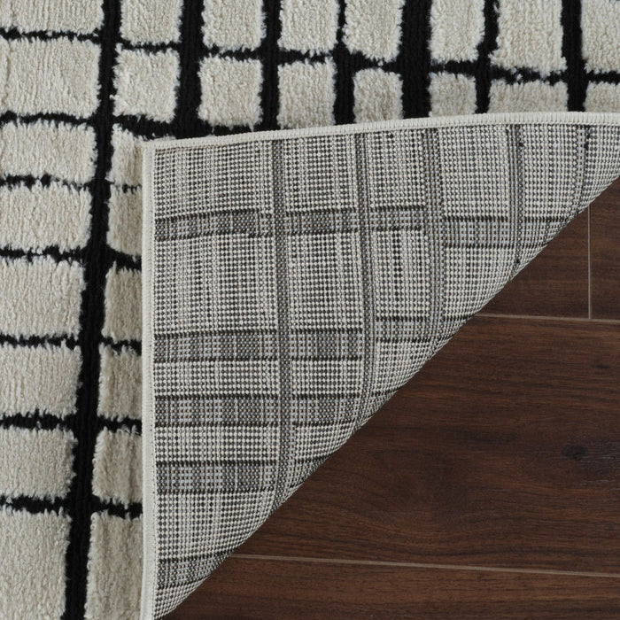 8' x 11' Modern Abstract Distressed Polypropylene Area Rug - Cream And Black