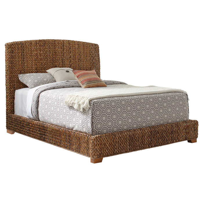 Laughton Banana Leaf Queen Panel Bed by CoasterEssence featuring a warm amber finish and detailed banana leaf carved headboard.