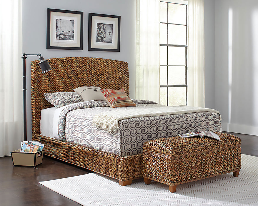 Laughton Banana Leaf Queen Panel Bed by CoasterEssence featuring a warm amber finish and detailed banana leaf carved design.