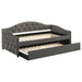 Grey Sadie upholstered twin daybed with trundle and wooden legs, featuring plush fabric and clean modern design.
