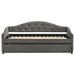 Grey Sadie upholstered twin daybed with trundle, showcasing its fabric-covered frame and modern furniture design.