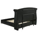 Black upholstered Eastern King Wingback Bed by CoasterElevations with high headboard and winged sides, modern furniture design.