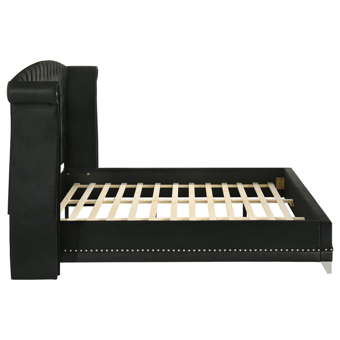 Black upholstered Eastern King Wingback Bed from CoasterElevations with tufted headboard and winged sides, modern furniture design.