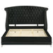 Black upholstered California King wingback bed from CoasterElevations with tufted headboard and elegant design.
